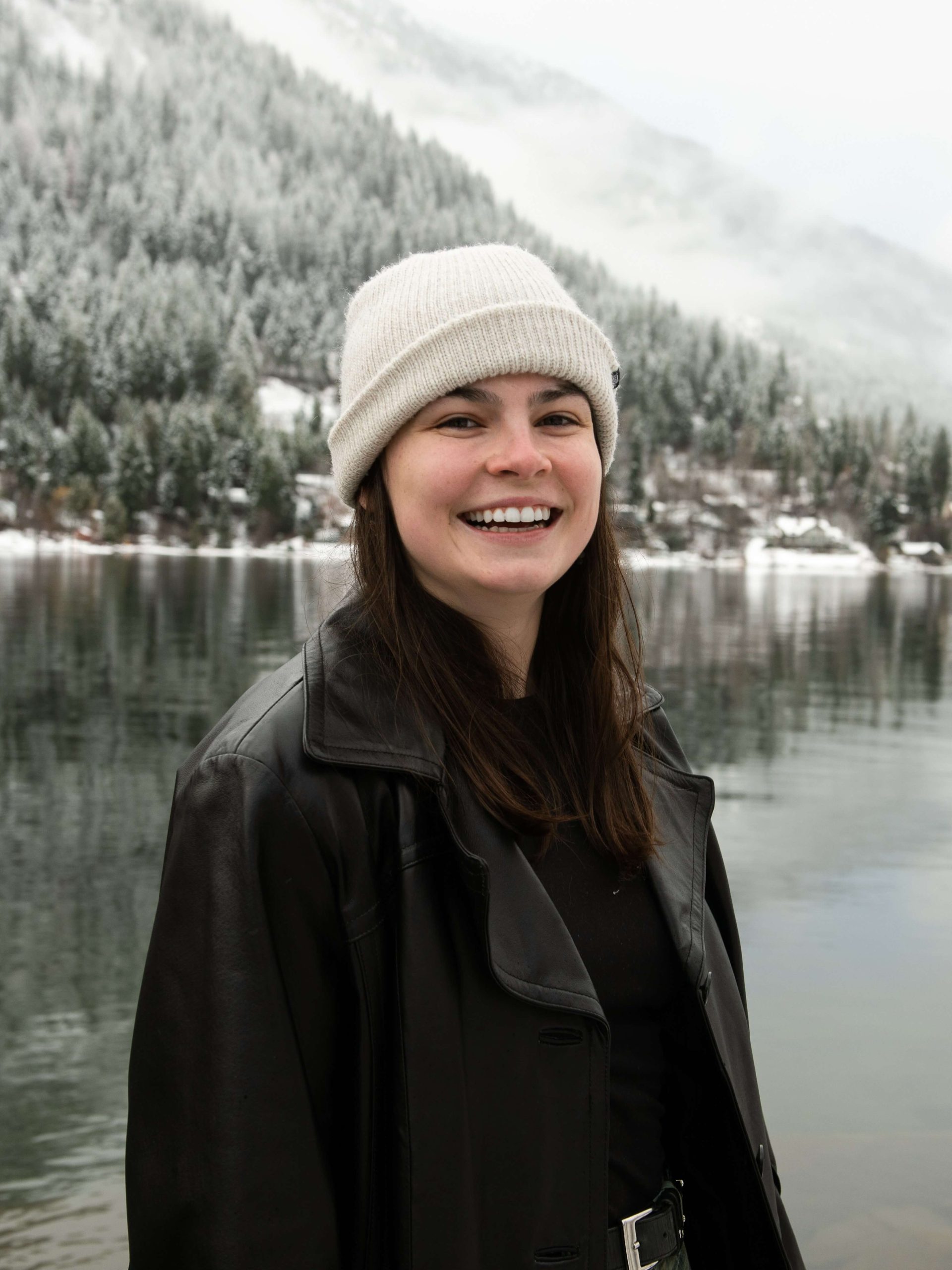 Quinn Bucciol standing in front of Kootenay Lake